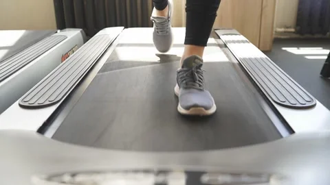 Close-up video of legs running on the treadmill Stock Footage 142144032
