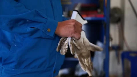 Close-up video of a maintenance technician’s hand wearing protective gloves.  스톡 동영상 304067422