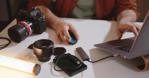 Close-up of a video maker's hands. Computer work. Filmmaker mounts on laptop Stock Footage 197500266