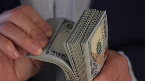 Close up video of man counting dollar banknotes, money calculation. Personal Stock Footage 287197817