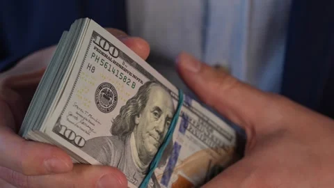 Close up video of man counting dollar banknotes, money calculation. Personal Stock Footage 287197959