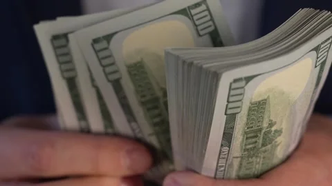 Close up video of man counting dollar banknotes, money calculation. Personal Stock Footage 287198010