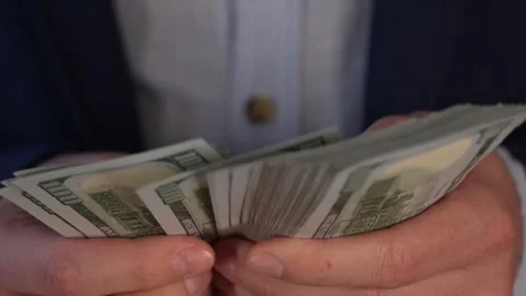 Close up video of man counting dollar banknotes with sun lights, money Vidéo 287198054