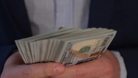 Close up video of man counting dollar banknotes, money calculation. Personal Stock Footage 287198083