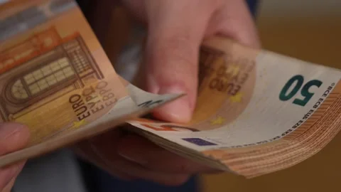 Close up video of man counting dollar banknotes with sun lights, money Stock Footage 287198206