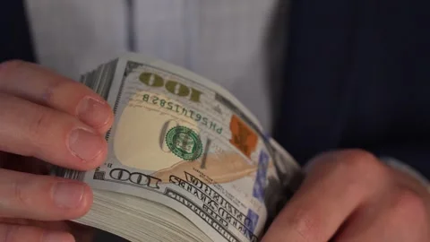 Close up video of man counting dollar banknotes with sun lights, money Stock Footage 287198209