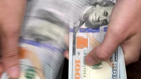 Close up video of man counting hundred dollar money by hands. Money in 100 .. Stock Footage 266475181
