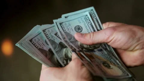 Close up video of man counting hundred dollar money by hands. Money in 100 .. Stock Footage 266476461