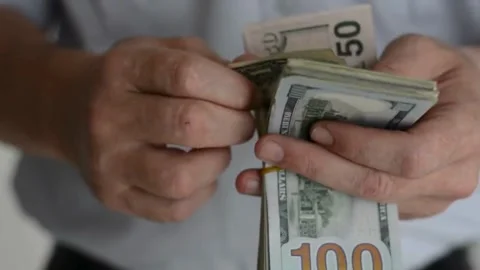 Close up video of man counting hundred dollar money by hands. Money in 100 Stock-Footage 336264317
