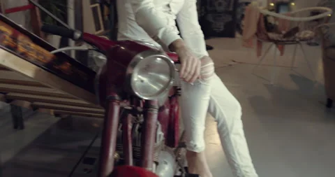 A close up video of a man sitting on his old motorcycle Stock Footage 135113071