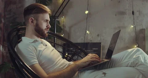 A close-up video of a man working on the Laptop. Stock Footage 135239137