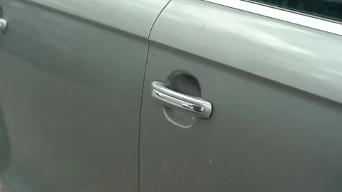 Close-up video of man's hand opens and closes the grey car door. Slow motion Video stock 208294664