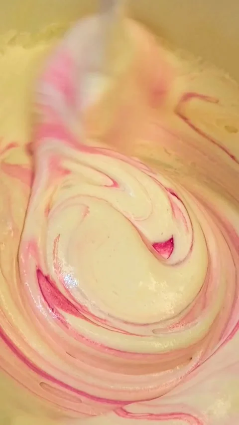 Close Up Video of Mixing Cake Batter Smoothly in a Baking Bowl Stock Footage 319876179