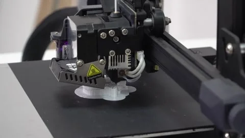 Close-Up Video of a Modern 3D Printer Making a White 3D Model 스톡 동영상 252354194