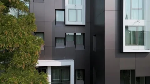 Close-up video of a modern building facade with geometric black panels and Stock Footage 311298917