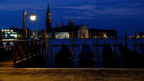 Close up video of moored gondolas on San Marco Square in Venice, Italy. Venic Stock Footage 99453329