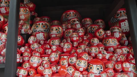 Close-up video of numerous red Daruma dolls displayed at Katsuoji Temple in Stock Footage 344278864