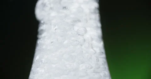 Close up video of the openning the bottle with soda water with bubbles in slow Stock Footage 161593500
