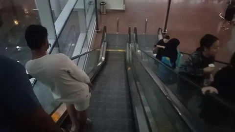 Close Up Video Of People Using Two-Way Escalator Stairs Inside Airport Stock Footage 304610377