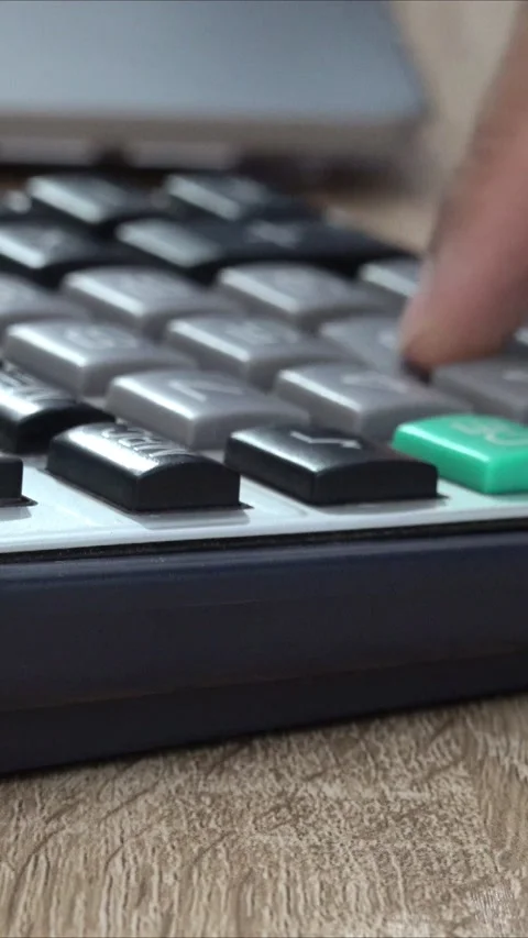 Close up video of a person pressing numbers on a calculator. Stock Footage 296789767