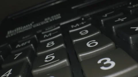 Close up video of a person using a classic calculator and pressing the numbers. Stock Footage 303068809