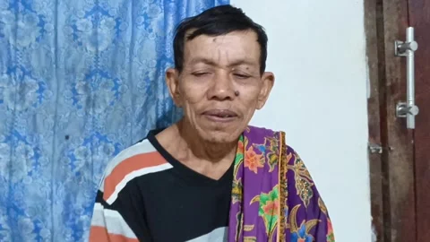 Close-up video portrait of an elderly Asian man looking at the camera. Stock Footage 319217973
