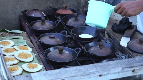 Close-up video of the process of making a delicious snack called surabi Stock Footage 280311643