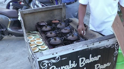 Close-up video of the process of making a delicious snack called surabi Stock Footage 280311786