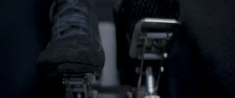 Close-up video of a race car drivers legs and feet engaging the pedals Stock Footage 318946262