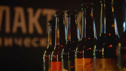 Close up video with rows of brown glass bottles with beer. Footage. Beautiful Stockbeeldmateriaal 142741233