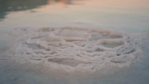 Close-up video of salt crystals in the Dead Sea at sunset. Stock-Footage 236239545