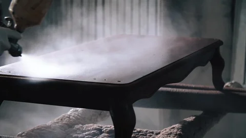 Close up Video Shot of Carpenter Working at his Workplace while covering Table Stock Footage 125909224