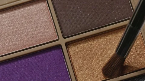 Close-up video showcases a rotating professional makeup eyeshadow palette Stock Footage 258655615
