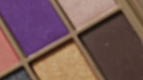 Close-up video showcases a rotating professional makeup eyeshadow palette Stock Footage 258655644