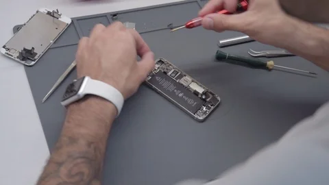 Close-up video showing process of mobile phone repair Video stock 91337476