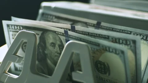 Close up video showing a stack of us dollar bills being counted by an elect.. Stock Footage 337445724