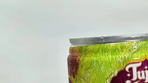 Close-up video shows a can of a local cold drink spinning Stock Footage 289923091