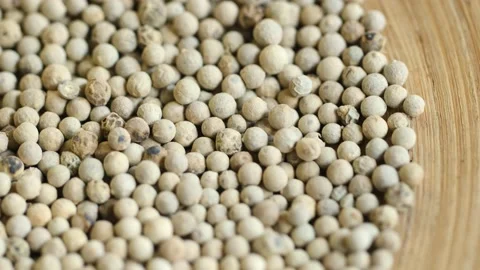 Close-up video of a slowly rotating white pepper Stock Footage 161154487