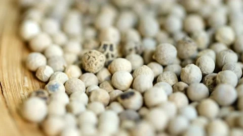 Close-up video of a slowly rotating white pepper Stock Footage 161392133