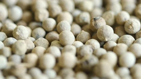 Close-up video of a slowly rotating white pepper Stock Footage 161930570