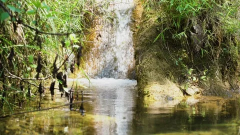 Close up video of small mountain waterfall Stock Footage 153223546