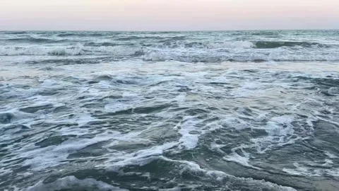 Close up video of small ocean waves with foamy bubbles Stock Footage 325327784