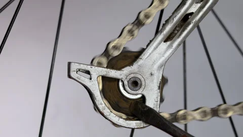 Close-up video of a small rear bicycle gear spinning while covered in baked.. Stock Footage 310259473