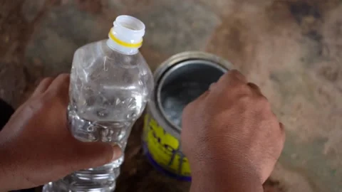 Close-up video of stirring paint in a can. Stock Footage 221880607