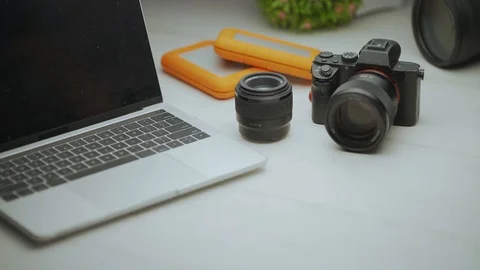 Close up video of tools of trade, professional camera and laptop Video stock 128406532