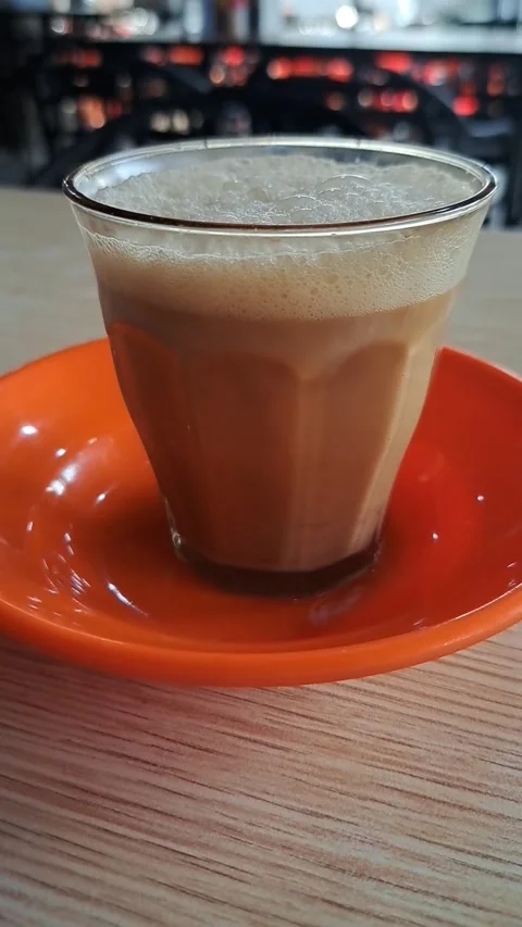 Close Up Video of Traditional Acehnese Sanger Coffee with Thick Frothy Foam Stock Footage 346412459