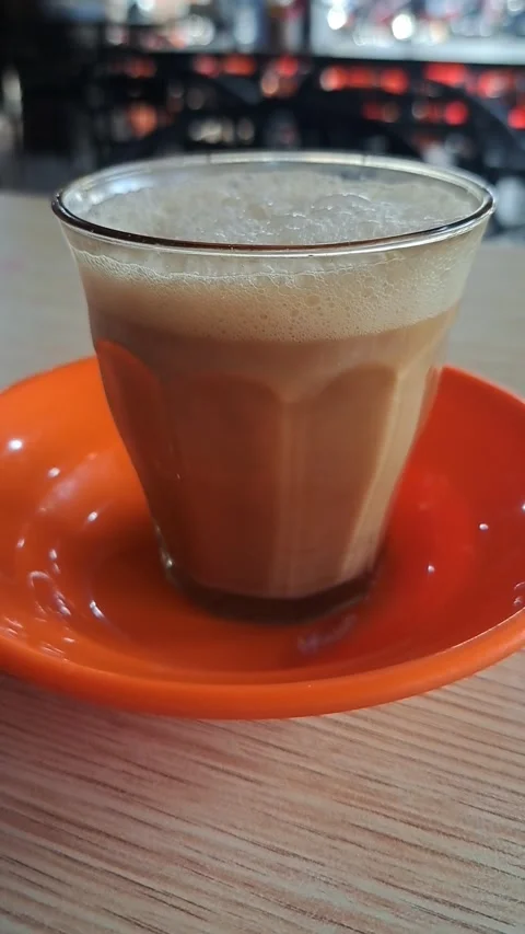 Close Up Video of Traditional Acehnese Sanger Coffee with Thick Frothy Foam Stock Footage 346412471