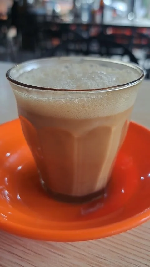 Close Up Video of Traditional Acehnese Sanger Coffee with Thick Frothy Foam Stock Footage 346412473
