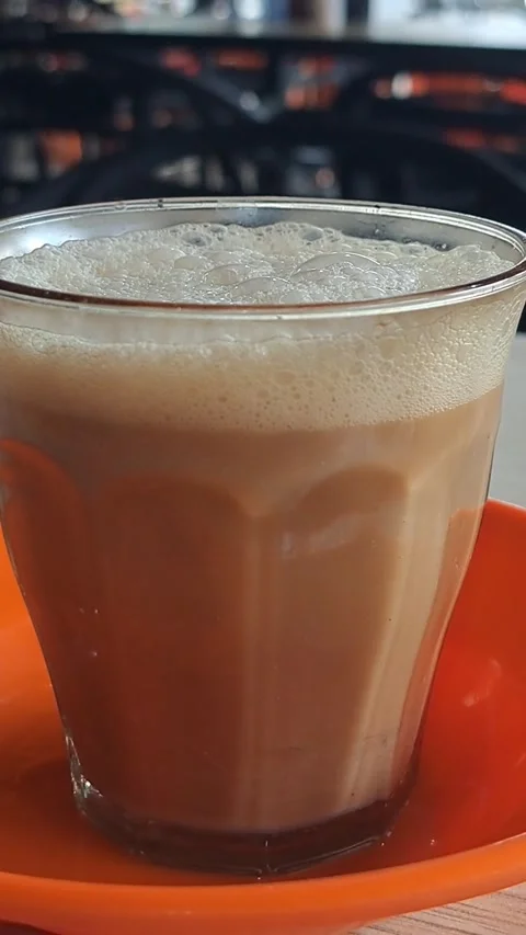 Close Up Video of Traditional Acehnese Sanger Coffee with Thick Frothy Foam Stock Footage 346412479