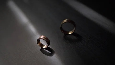 Close up video of two wedding rings in the rays of light Video stock 101571219